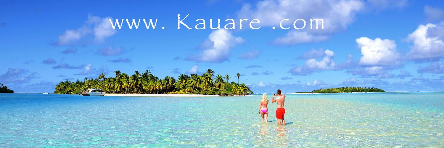 Couple walking in the turquoise lagoon on Aitutaki Island, Cook Islands